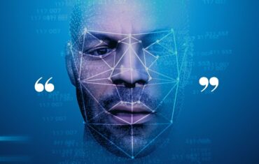 A man's face with a speech bubble, highlighting Biometrics Institute members' call for a consistent approach to facial recognition.