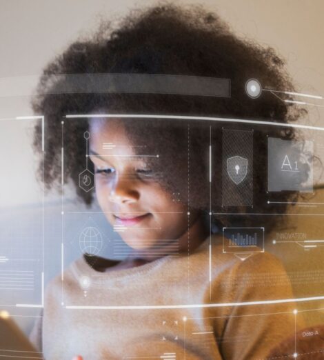 A young person using a tablet with virtual shield graphics